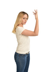 3/4 portrait of blonde girl wearing white shirt. isolated on white background.