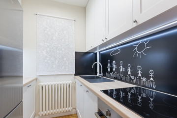 Modern kitchen interior with chalkboard wall