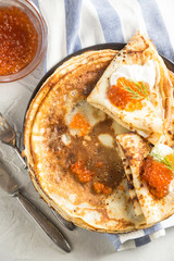 Russian pancakes with red caviar