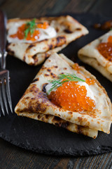 Russian pancakes with red caviar