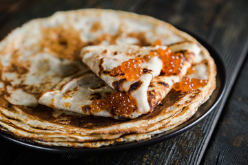 Russian pancakes with red caviar