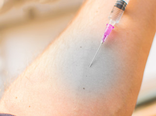 A stab in the arm. The effect of "necrosis" on the injection.