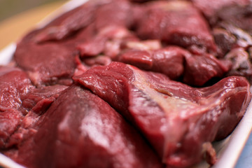 Sliced raw beef.