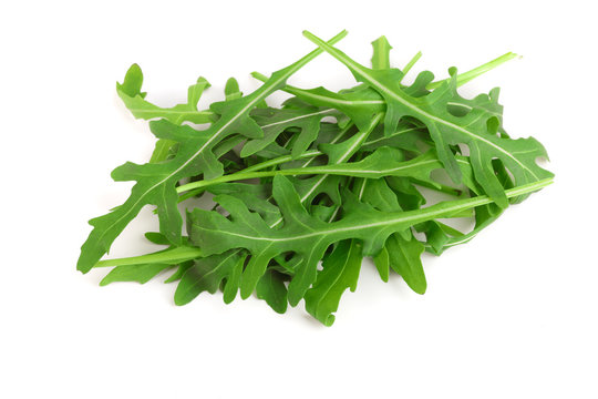 Heap of Green fresh rucola or arugula leaf isolated on white background