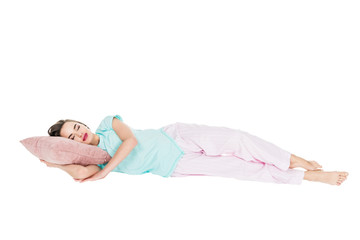 girl in pajamas sleeping on pillow isolated on white