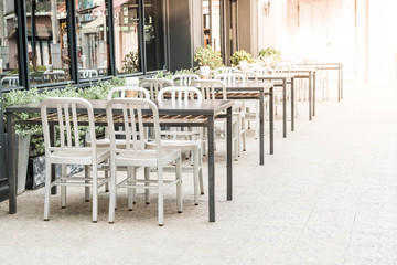 empty wood table and chair in outdoor restaurant