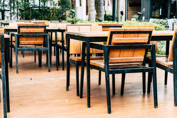 empty wood table and chair in outdoor restaurant