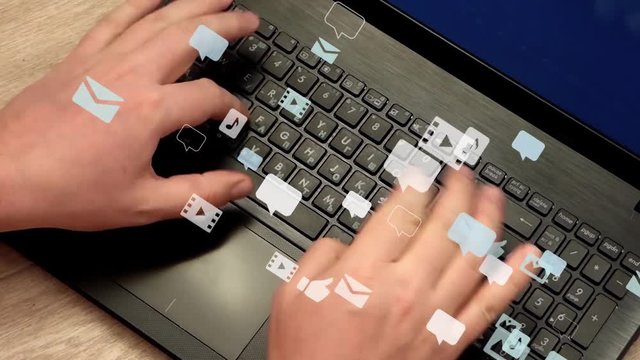 Caucasian man hands rapidly typing on laptop keyboard. Lot of speech bubbles, image icons, sound and video icons fly away. Communication in social networks, chatting. Real video with 3d animation.