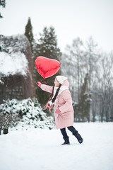 Happy exited girl with Valentine heart balloons outdoor. Valentine's day concept. Copy space.