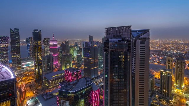 The skyline of the West Bay area from top in Doha day to night timelapse, Qatar.