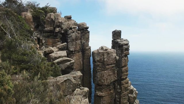 top of a dolerite column at cape pillar on the three capes track in tasmania