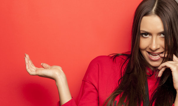 beautiful advertising woman in a red blouse on red background