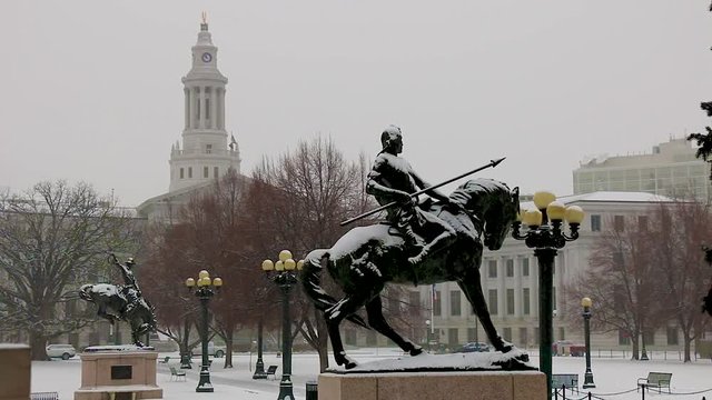 Native American statue in a snow storm