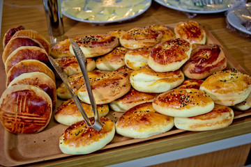 Turkish buns lie on a tray in the restaurant