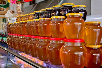 Large assortment of honey in jars