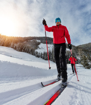 Cross-country skiing. Young man and woman doing exercise