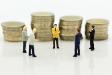 Miniature people: Group businessman negotiates business, planning. Image use for business concept.