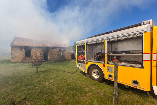 firefighters in action SHOWING FIRE FIGHTING VEHICLE AND EQUIPMENT