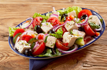 Dish of healthy fresh Greek salad with feta cheese