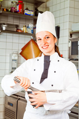 Female Chef In Kitchen