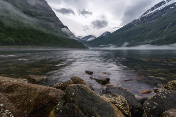 Beautiful landscape in Geiranger from the lowest point very close to the water, one of the most beautiful fjords of Norway