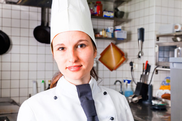 Female Chef In Kitchen