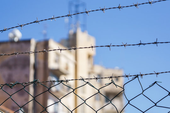 Photo of barbed wire on blurred background during day