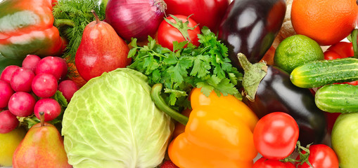 Fresh fruits and vegetables background. Wide photo.
