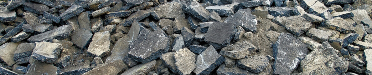 Panoramic view of a stockpile with asphalt piles, which are prepared on the heap for removal to orderly disposal.
