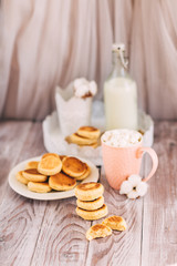Obraz na płótnie Canvas cookie, bottle of milk, Cup with marshmallows