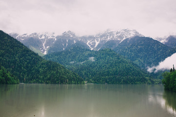 Fototapeta na wymiar the lake and snow-capped mountains