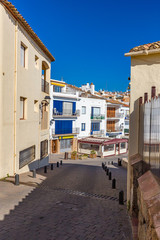 Fototapeta premium Typical street detail in a small village Calella de Palafrugell (Costa Brava, Spain)