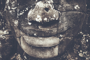 Smile of Bayon Temple Angkor Thom, stone faces Cambodia. Huge sculptures of faces in the archaeological site of Angkor Thom. Face-towers depicting Bodhisattva Avalokiteshvara. color Vintage style
