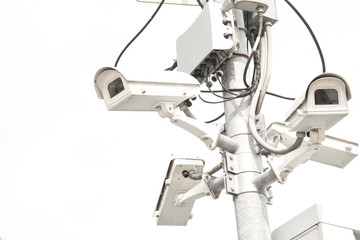 Many Close Circuit Television with pole on white background.