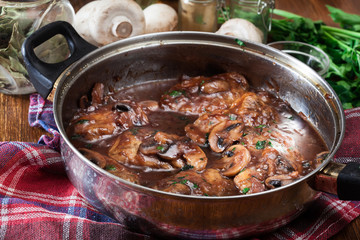 Delicious chicken marsala on frying pan