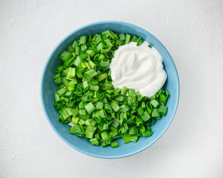 Sliced green onions or scallions in a bowl