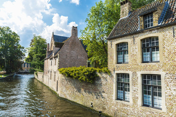 Fototapeta na wymiar Old traditional houses along the river in Bruges, Belgium