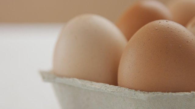 closeup of six brown eggs with different shel texture