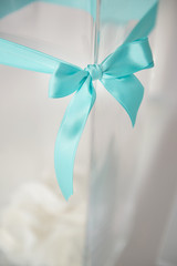 blue bow on glass vase