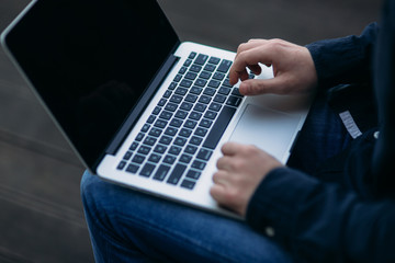 The young manager working on a laptop on coffe break. Lunch Break.