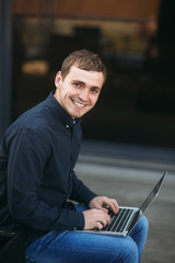 The young manager working on a laptop on coffe break. Lunch Break.