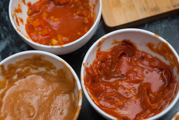 Three Kinds of Red Tomato Sauce in White Ceramic Bowls at the Restaurant Kitchen, Barbecue Sauce, Sweet and sour Chinese sauce. Top view