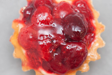 Dessert Pastry Basket or Tartlet with Strawberris with Berries on Gray Background Isolated. Close up. Food Dessert. Macro.
