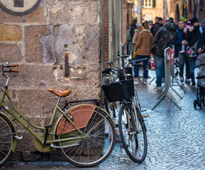 Naklejka na ściany i meble Two bicycles in a Cobbled Street