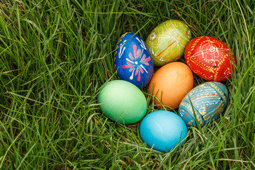 Fototapeta na wymiar Painted Easter eggs in spring green grass