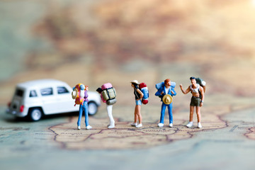 Miniature backpacker on map with car, Concept of Travel around the world and the adventure. - Powered by Adobe