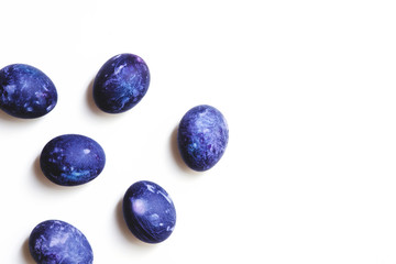 Stylish background of ulta violet Easter eggs isolated on white. Dyed Easter eggs