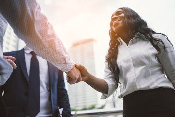 handshake of business People Colleagues Teamwork Meeting .Hold hand and shaking hand in city