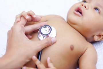 Doctor Using A Stethoscope To Listen To Baby's Chest , Baby Health Concept