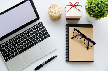 Top view,Flat lay workspace with mock up Notebook and Laptop on the desk copy space for your text.